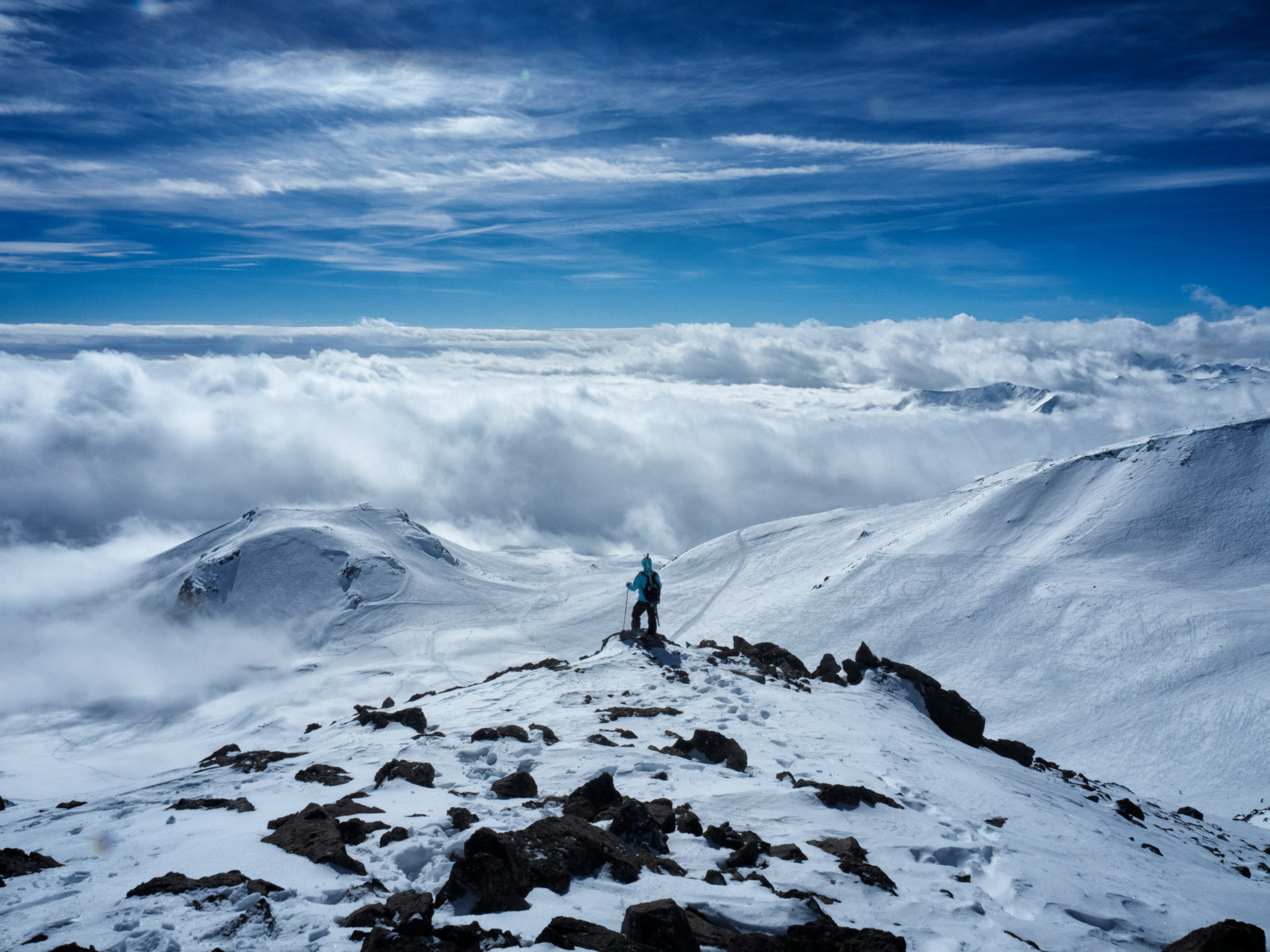 person on snow covered mountain